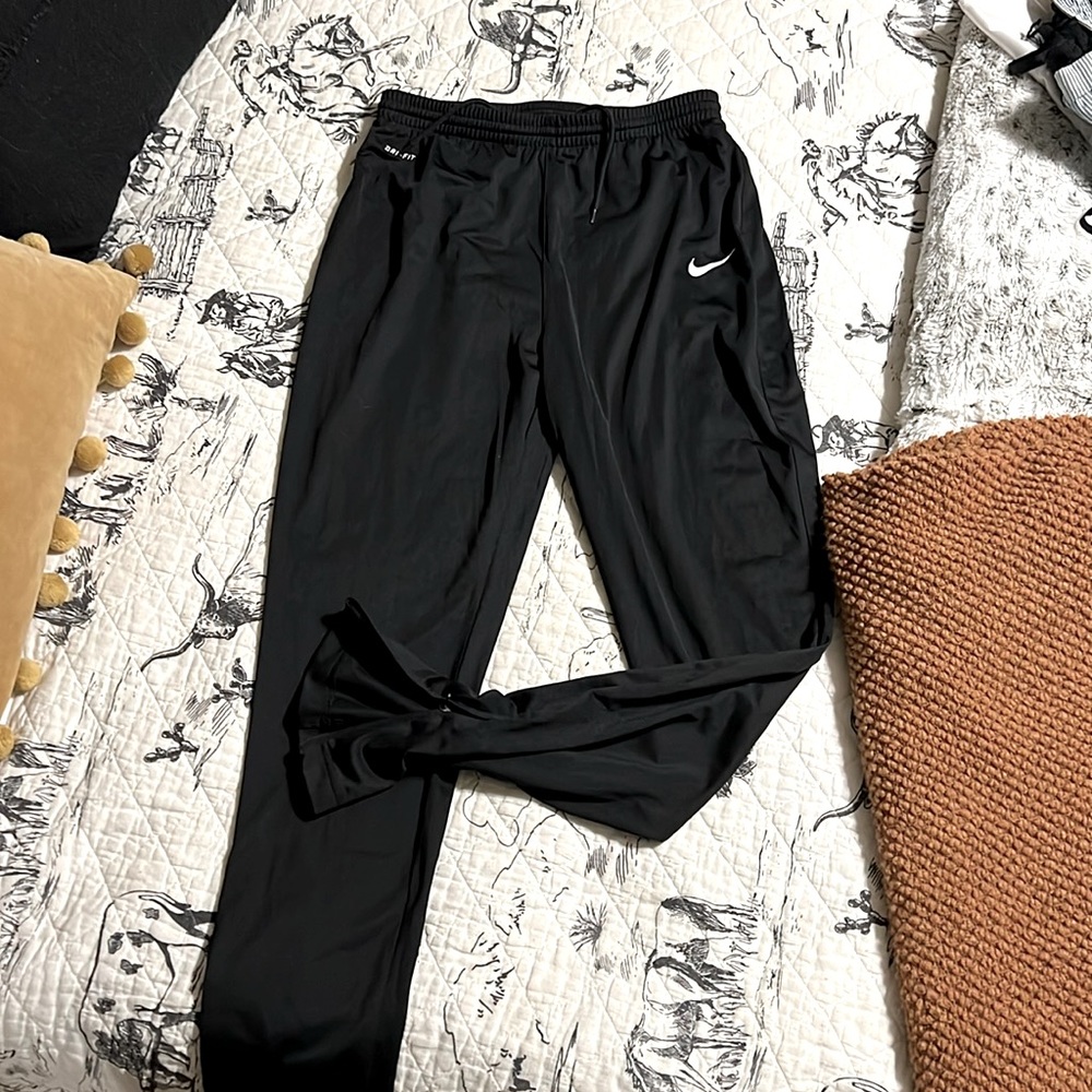 Nike Dri-fit track pants. Zip ankle. Black size M